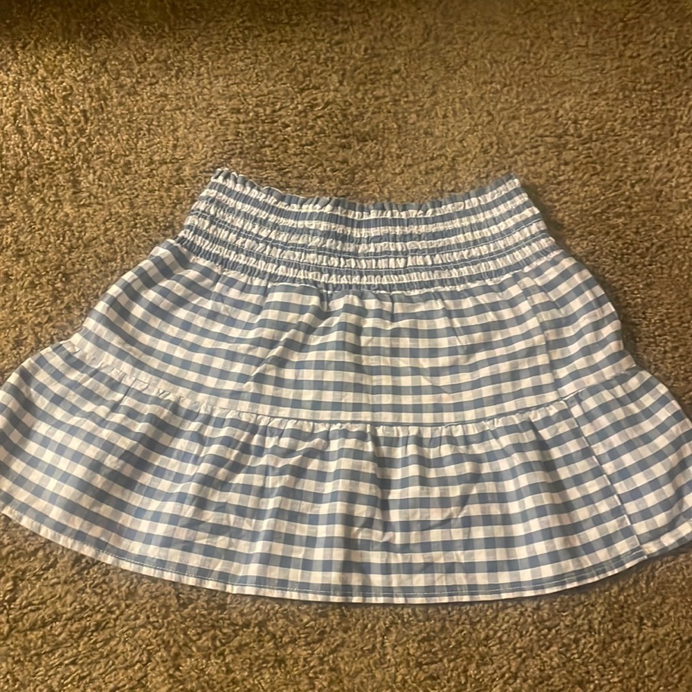 Blue and white skirt only worn once it is a size 7/8 but It is so Stretchy